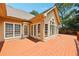 Wide angle image of a wooden deck with an exterior view of the house at 8110 Lakemont Close, Mcdonough, GA 30253