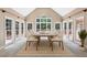 Well-lit dining room with a table set for eight and lots of natural light at 8110 Lakemont Close, Mcdonough, GA 30253