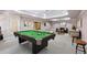 Spacious game room featuring a pool table, seating area, and neutral color palette at 8110 Lakemont Close, Mcdonough, GA 30253