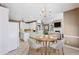 Open concept kitchen and dining area with white cabinets at 8110 Lakemont Close, Mcdonough, GA 30253