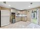 Functional kitchenette with ample storage and a view of the backyard at 8110 Lakemont Close, Mcdonough, GA 30253
