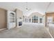 Open living room with fireplace, built-in shelving, and large windows to the deck at 8110 Lakemont Close, Mcdonough, GA 30253