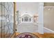 Welcoming foyer view into the living room featuring an open layout and lots of natural light at 8110 Lakemont Close, Mcdonough, GA 30253