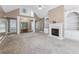 Comfortable living room with a fireplace, built-in shelves, and elegant front door at 8110 Lakemont Close, Mcdonough, GA 30253