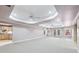 Expansive living room with abundant natural light, recessed lighting, and tray ceiling at 8110 Lakemont Close, Mcdonough, GA 30253