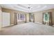 Expansive main bedroom boasts plush carpeting and large windows at 8110 Lakemont Close, Mcdonough, GA 30253