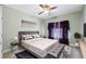 Luxurious main bedroom boasts plush bedding, elegant decor, and a relaxing atmosphere for rest at 8110 Lakemont Close, Mcdonough, GA 30253