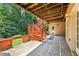 Under-deck patio with access to the backyard and features a walkway and stairs at 8110 Lakemont Close, Mcdonough, GA 30253