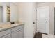Bathroom features a granite countertop vanity and black fixtures at 10137 Cormac St, Jonesboro, GA 30238