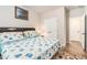 Bedroom with hardwood floors, neutral walls, and nautical-themed accents at 10137 Cormac St, Jonesboro, GA 30238