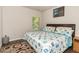 Bright bedroom with hardwood floors and a nautical-themed bedspread at 10137 Cormac St, Jonesboro, GA 30238