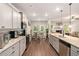 Modern kitchen with stainless steel appliances and wood floors at 10137 Cormac St, Jonesboro, GA 30238