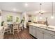 Bright eat-in kitchen with wood floors and a large island at 10137 Cormac St, Jonesboro, GA 30238