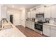 Modern kitchen featuring granite countertops, stainless steel appliances, and ample cabinet space at 10137 Cormac St, Jonesboro, GA 30238