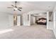 Spacious main bedroom with a ceiling fan and a large carpeted seating area at 10137 Cormac St, Jonesboro, GA 30238