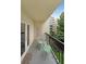 View of balcony with chairs looking out at an apartment building and green space at 1800 Clairmont Lk # 313, Decatur, GA 30033