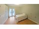 Spacious bedroom with hardwood floors and doors leading to a balcony at 1800 Clairmont Lk # 313, Decatur, GA 30033