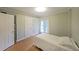 Light-filled bedroom boasts hardwood floors, balcony access and a calming ambiance at 1800 Clairmont Lk # 313, Decatur, GA 30033