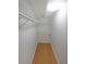 Walk-in closet with white shelving provides ample storage and organization at 1800 Clairmont Lk # 313, Decatur, GA 30033