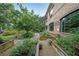 Beautiful raised garden beds and landscaping surrounding a brick building, enhancing its curb appeal at 1800 Clairmont Lk # 313, Decatur, GA 30033