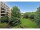 Scenic view of the common green space with mature trees and walkways at 1800 Clairmont Lk # 313, Decatur, GA 30033