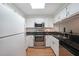 Modern kitchen features stainless steel appliances, granite countertops and white cabinets at 1800 Clairmont Lk # 313, Decatur, GA 30033