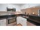 Updated kitchen featuring stainless steel appliances and dark countertops at 1800 Clairmont Lk # 313, Decatur, GA 30033