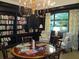 Charming library featuring floor-to-ceiling bookshelves, comfortable seating, and elegant chandelier at 1800 Clairmont Lk # 313, Decatur, GA 30033