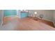 A large open-concept living room features wood floors and views of the kitchen at 1800 Clairmont Lk # 313, Decatur, GA 30033