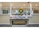 Bright lobby featuring a display table with three drawers and several windows, creating a welcoming atmosphere at 1800 Clairmont Lk # 313, Decatur, GA 30033