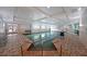 Indoor pool with steps leading into the water, tiled flooring, recessed lights, and natural light from windows at 1800 Clairmont Lk # 313, Decatur, GA 30033