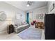Cozy bedroom featuring a comfortable sofa, stylish decor, and ample storage for a belongings at 3111 Old Thompson Mill Rd, Buford, GA 30519