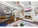 Bright living room with fireplace, built-ins, and large windows offering a view of the outdoors at 3111 Old Thompson Mill Rd, Buford, GA 30519
