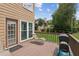 Wooden back deck with seating and a grill overlooks the backyard at 1850 Thomas Ne Dr, Marietta, GA 30066