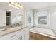 Bright bathroom features a jacuzzi tub, double windows, and granite counters for a spa-like retreat at 1850 Thomas Ne Dr, Marietta, GA 30066