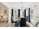 Comfortable dining area with large windows, stylish decor, and adjacent living spaces at 1850 Thomas Ne Dr, Marietta, GA 30066