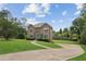 Charming two-story home with manicured lawn and inviting blue door at 1850 Thomas Ne Dr, Marietta, GA 30066