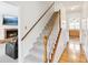 Hallway with stairs leading to upper levels, connecting to the living room and kitchen at 1850 Thomas Ne Dr, Marietta, GA 30066