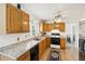Well-lit kitchen featuring stainless steel appliances, granite countertops, and ample cabinet space at 1850 Thomas Ne Dr, Marietta, GA 30066