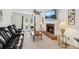 Cozy living room featuring a brick fireplace, plush seating, and a ceiling fan for added comfort at 1850 Thomas Ne Dr, Marietta, GA 30066