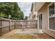 Backyard with patio, wooden fence providing privacy and space for outdoor activities at 303 Barberry Pl, Canton, GA 30114