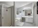 Bathroom featuring a shower, bathtub, vanity with sink, and decorative elements at 303 Barberry Pl, Canton, GA 30114