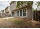 Back of house featuring a patio area, fenced yard, sliding glass doors and large windows at 303 Barberry Pl, Canton, GA 30114