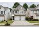 Charming two-story home with a well-maintained front yard and a two-car garage at 303 Barberry Pl, Canton, GA 30114