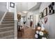 Welcoming entryway with staircase, stylish decor, and wood-look flooring at 303 Barberry Pl, Canton, GA 30114