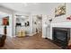 Spacious living room showcasing a fireplace, hardwood floors, and an open layout at 303 Barberry Pl, Canton, GA 30114
