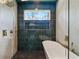 Luxury bathroom featuring window over soaking tub with shower and tile surround at 3087 Alston Dr, Decatur, GA 30032