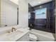 A modern bathroom features a tub, tile detail and gold hardware at 3087 Alston Dr, Decatur, GA 30032