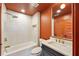 Modern bathroom featuring a tub, shower, and contemporary vanity with gold fixtures and neutral tile at 3087 Alston Dr, Decatur, GA 30032