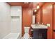 Stylish bathroom with a modern vanity, bathtub, neutral tile, and contemporary lighting at 3087 Alston Dr, Decatur, GA 30032